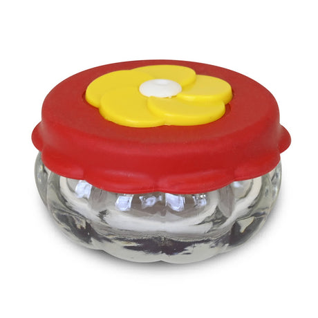 Handheld Hummingbird Feeder: Clear container with a red lid, designed to hold nectar. Ideal for attracting hummingbirds, easy to hold or place on surfaces.