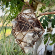 Alpaca Diamond Nester: A diamond-shaped grapevine ball filled with white alpaca fiber for birds to build warm, dry nests.