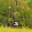 Beaded Hummingbird Perch with a bird sitting on the feeder, showcasing a durable copper frame and decorative beads for easy bird watching.