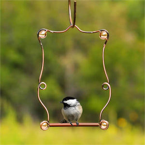 Beaded Hummingbird Perch with a bird sitting on the feeder, showcasing a durable copper frame and decorative beads for easy bird watching.