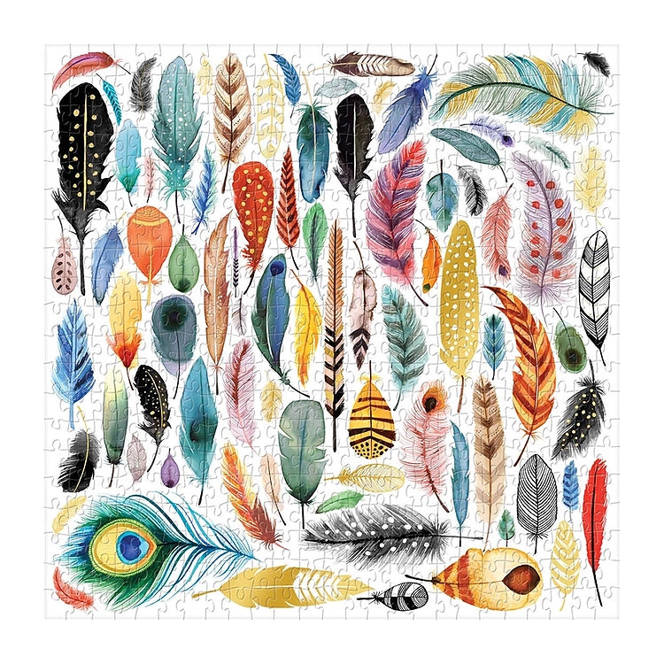 Completed Galison Feathers 500-piece jigsaw puzzle featuring colorful bird feathers, a peacock feather and gold foil details