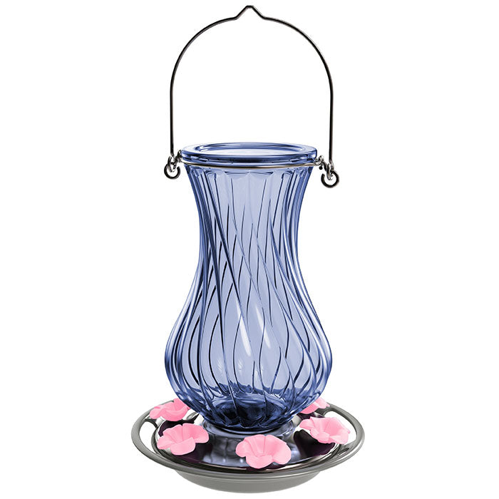 Perfect Pitcher Antique Glass Gravity Hummingbird Feeder with blue glass, handle, and flower ports. Features a metal plate with pink flowers, enhancing your backyard haven.