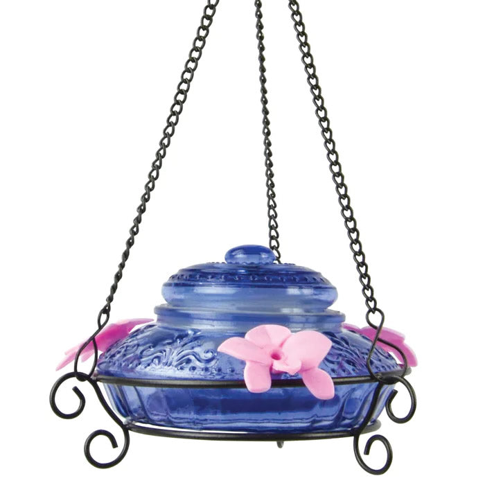 Nature's Way Illuminated Antique Top-Fill Glass Hummingbird Feeder, featuring a blue glass design, hanging on a chain, with three flower feeding ports.