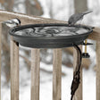 Heated Bird Bath Clamp Mount with birds drinking from the bath, providing essential water in freezing temperatures. Durable, thermostatically controlled, fits railings up to 2 inches thick.