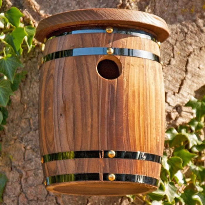 Barrel Bird Nester: A wooden barrel with a hole, designed for small wild birds, offering predator-safe nesting in your garden. Crafted from FSC® Timber.