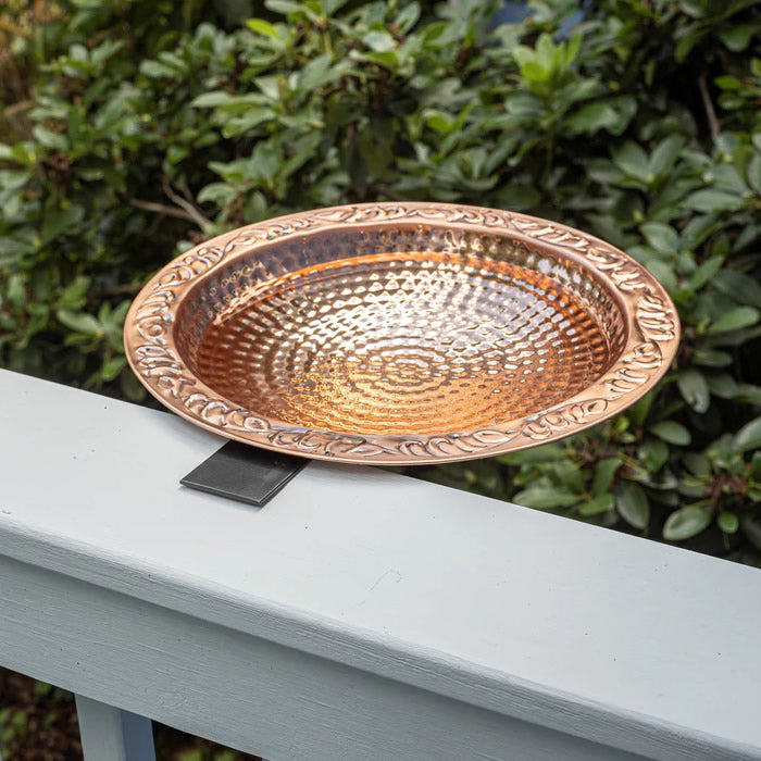 Pure Copper Deck Mount Bird Bath with textured copper bowl on a black railing mount, designed for easy viewing and cleaning, enhancing outdoor spaces by attracting birds.