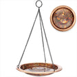 Hanging Fired Copper Bird Bath with an artisan-hammered 13.5 bowl, shallow basin, ridges, and durable chain for perching birds.