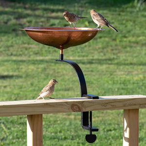 Rail Mounted Hammered Copper Bird Bath with birds perched on the rim, featuring a hammered copper basin and sturdy wrought iron deck mount.