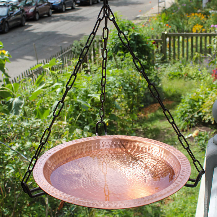 Hanging Hammered Solid Copper Bird Bath with wrought iron chain, featuring a hammered copper bowl, perfect for birds to drink and bathe.