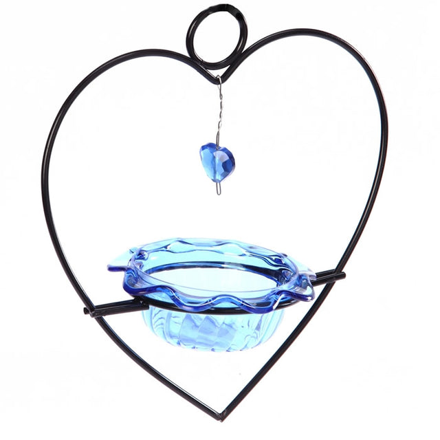 Bluebird Heart Feeder with blue glass bowl, heart-shaped metal holder, and decorative blue gem, designed for easy feeding and cleaning.