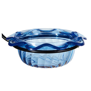 Blue glass bowl with wavy design on a white background