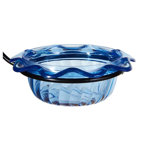 Blue glass bowl with wavy design on a white background