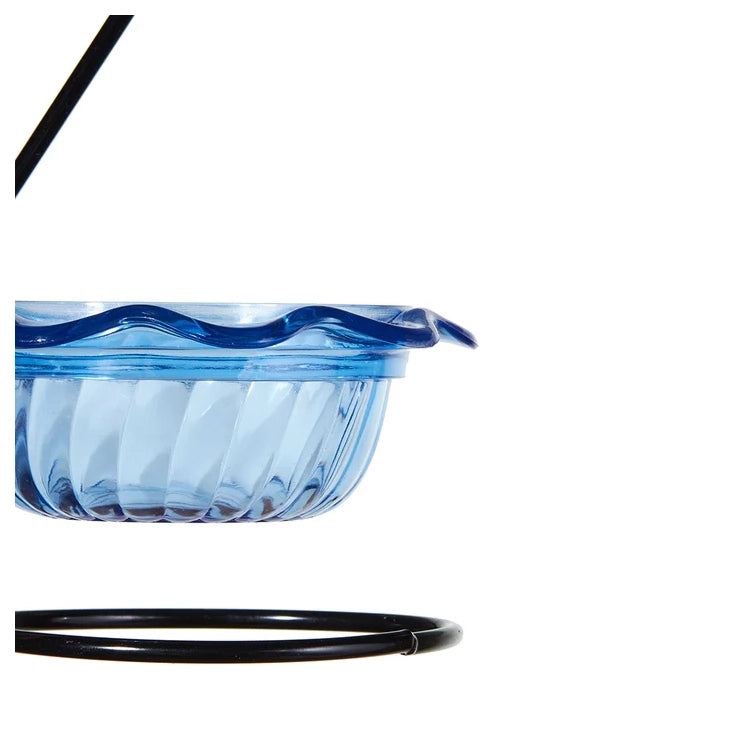 Blue glass bowl with wavy design on a white background