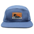 Bird Collective Common Loon Camp Hat featuring a duck patch, flat bill, and adjustable strap, perfect for outdoor enthusiasts and bird lovers.