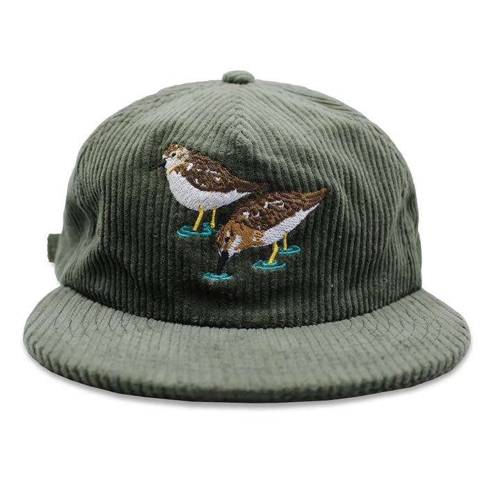 Bird Collective Least Sandpipers Chunky Corduroy Hat featuring embroidered birds, flat bill, unstructured 6-panel crown, and adjustable strap for comfortable outdoor adventures.