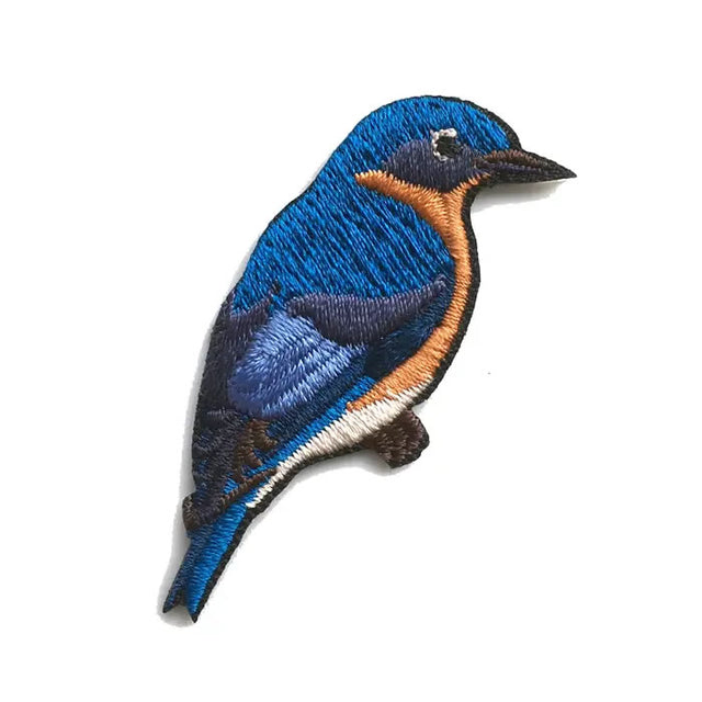 Bird Collective Eastern Bluebird Patch with intricate embroidery, showcasing the bird's detailed feathers. Iron-on backing for easy application to clothing or accessories.