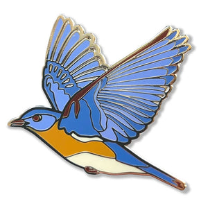 Bird Collective Northern Cardinal or Eastern Bluebird Pin featuring a blue bird with wings spread, gold trim, and black rubber clutch backing.