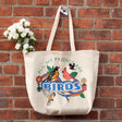 Bird Collective Bird Friends Tote Bag featuring vibrant bird and flower illustrations, durable canvas, and spacious interior for birdwatching essentials.