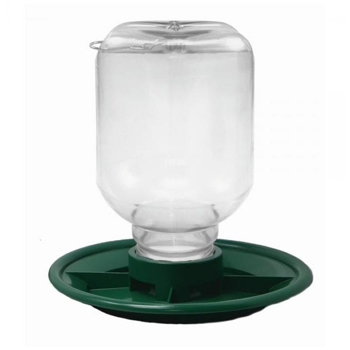 Switch N Swap 48 oz. Seed Feeder with clear glass hopper, white lid, and green base on a green tray, designed for easy filling and cleaning.