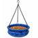 Blue ceramic hanging bird feeder filled with dried mealworms to attract bluebirds, chickadees, wrens, and other insect-eating backyard birds.