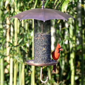 Umbrella Bird Feeder, Mesh: A close-up of a bird feeder with a copper-plated umbrella, showing a red bird feeding from the durable mesh tube.