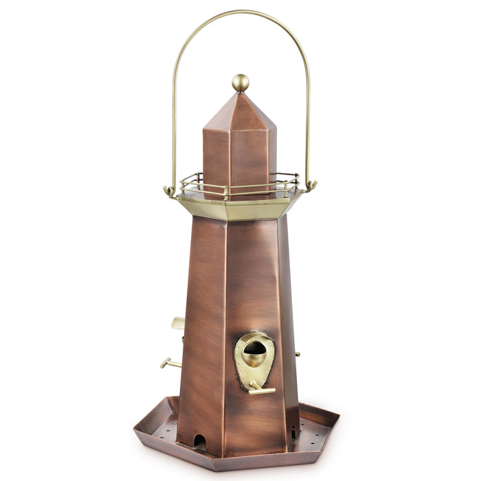 Lighthouse Bird Feeder with brass and copper finishes, spacious base tray, three perches, and weather-resistant design for attracting songbirds.