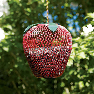 Apple Wire Mesh Bird Feeder: Apple-shaped, metal mesh with diamond openings and solid bottom, hanging on a tree. Holds sunflower seeds, easy refills, and handmade.