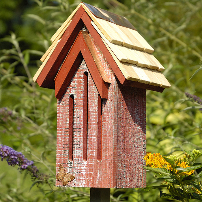 Mademoiselle Butterfly House: Wooden birdhouse with a copper butterfly on top, features a hand-shingled roof and includes a 30-inch wooden mounting stake.