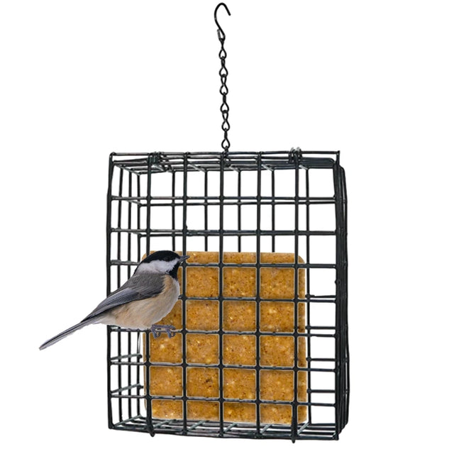 A black metal hanging bird feeder cage with a yellow seed block inside, shown against a white background with a small bird perched on the front.