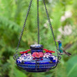 Bloom Perch Botanica Hummingbird Feeder with handblown glass, three perches, and bee-resistant feeding ports, attracting hummingbirds to your yard.