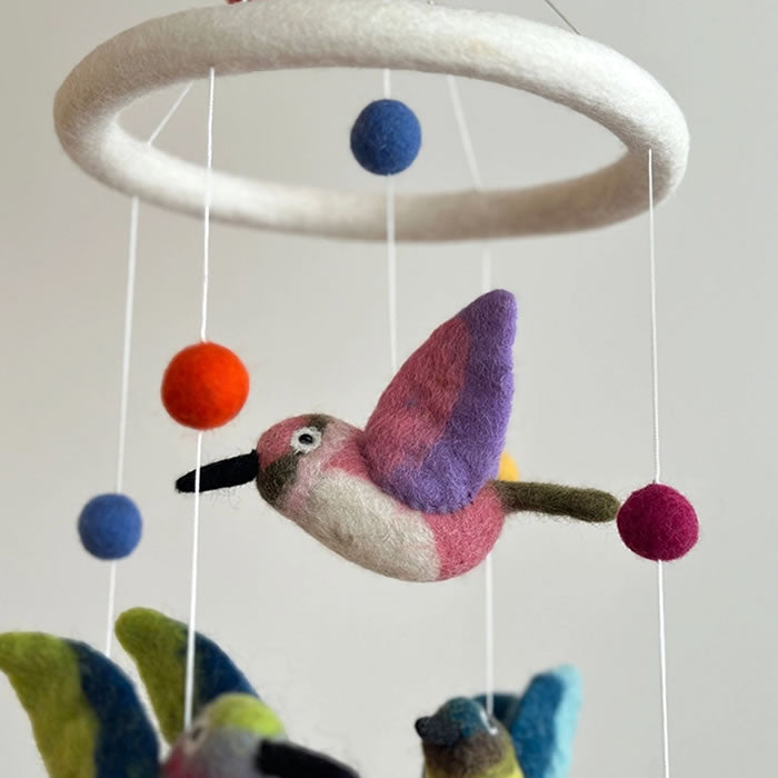 Felt Hummingbird Mobile showing handcrafted felt birds and balls, perfect for adding charm and nature's beauty to any indoor space.