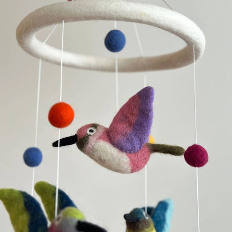 Felt Hummingbird Mobile showing handcrafted felt birds and balls, perfect for adding charm and nature's beauty to any indoor space.