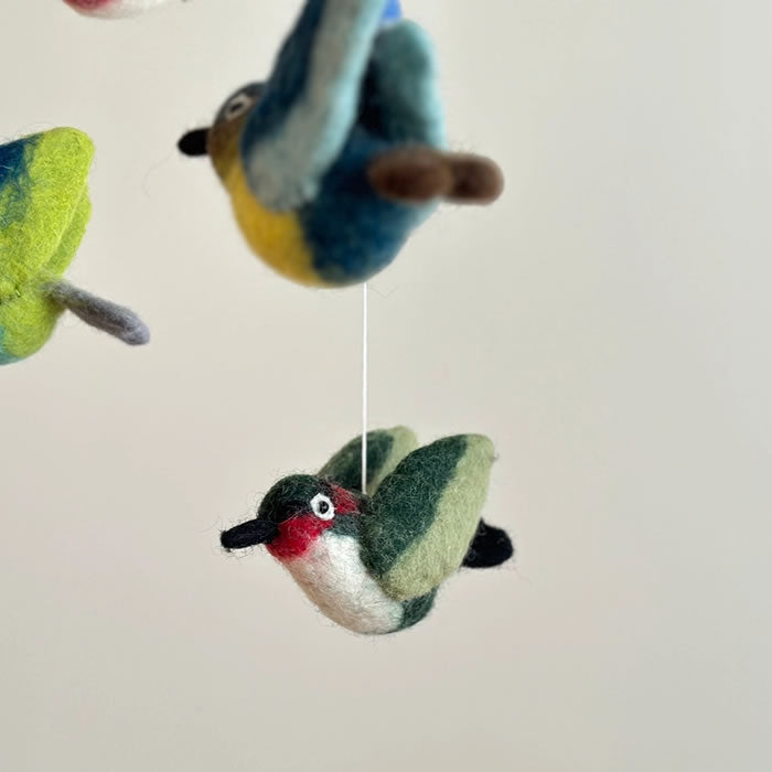 Felt Hummingbird Mobile featuring handcrafted felt birds, swaying gently, perfect for nurseries or living spaces, adding charm and a touch of nature.