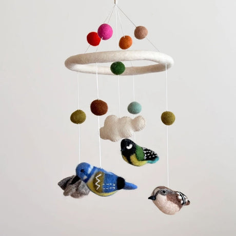 Felt Bird Mobile featuring handcrafted wool-felt birds and balls, ideal for adding a charming and serene touch to any room's decor.