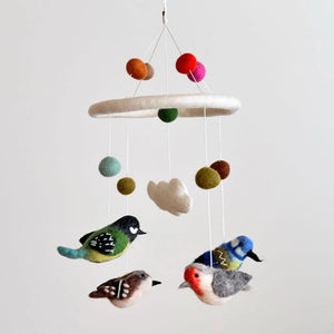 Felt Bird Mobile featuring handcrafted felt birds and balls, perfect for adding a whimsical touch to any room's decor.