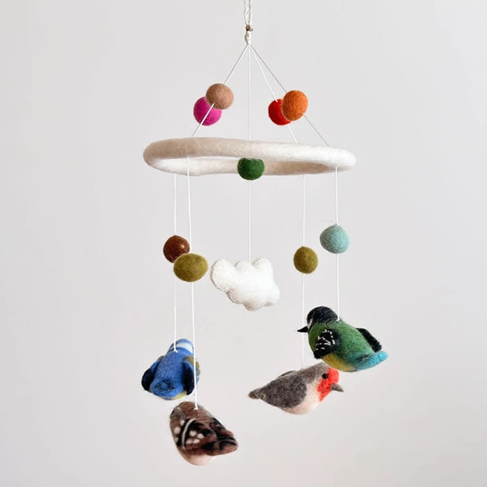 Felt Bird Mobile featuring handcrafted felt birds, balls, and delicate strings, ideal for adding a whimsical touch to any room. Made in Nepal.