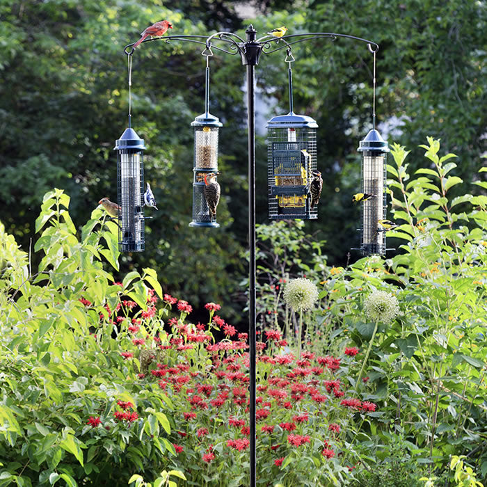 BirdsUP™ 1 Versa Pole System in a garden, holding multiple bird feeders, easy setup with bullseye level, Quadra Cut Screw™, and durable construction.