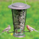 Squirrel-X2 bird feeder with clear seed tube, metal lid, two songbirds perched; features squirrel-proof, spring-loaded perches for easy bird viewing.