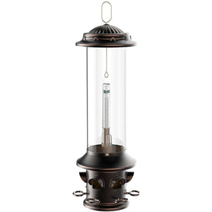 Squirrel-X5 bird feeder: a tall, metal cylinder with a glass tube, six feeding ports, and squirrel-proof features, including spring-loaded perches and a clear plastic reservoir.