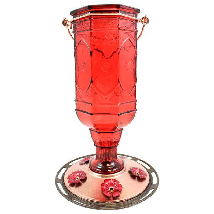 Red Jewel Hummingbird Feeder featuring decorative embossed hummingbirds, red flower-shaped feeding ports, a wraparound perch, and a durable metal base for easy cleaning and refills.