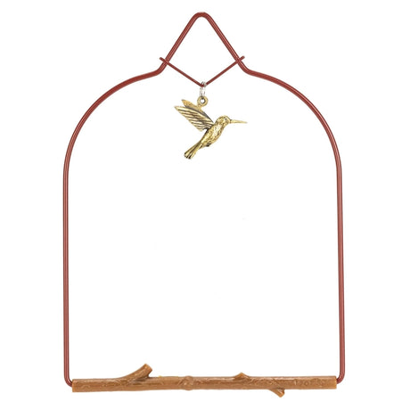 Decorative metal arch with a gold hummingbird ornament on a white background