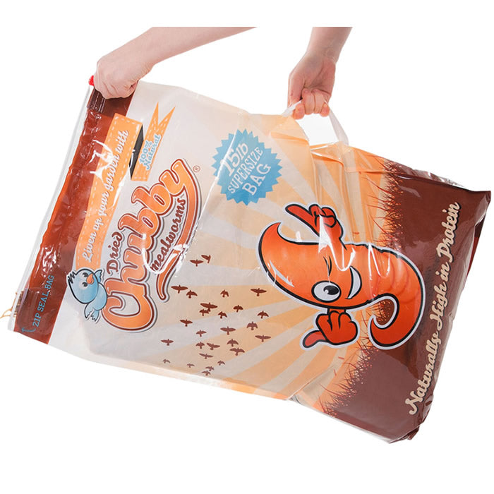 Person holding 15 lbs. Chubby Mealworms bulk bag with built-in handle, ideal for feeding insect-eating birds protein-rich dried mealworms.