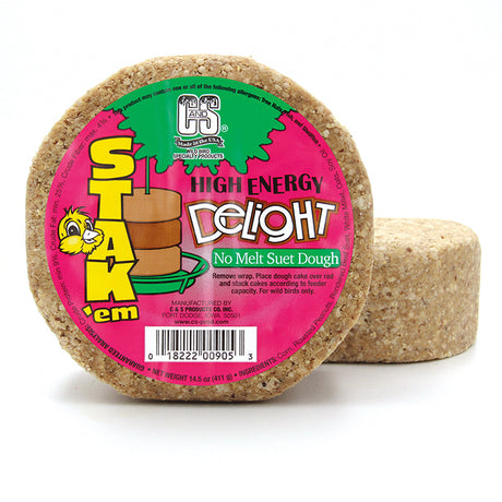 High Energy Delight Suet Stak'em, Set of 6: A round suet treat with a pink label, designed to attract birds, featuring corn, peanuts, millet, and oats.