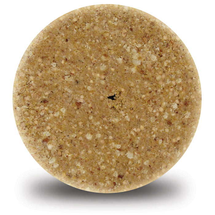 Close-up of High Energy Delight Stak'em, Set of 6, a round suet treat for birds with a central hole, featuring corn, peanuts, millet, and oats.