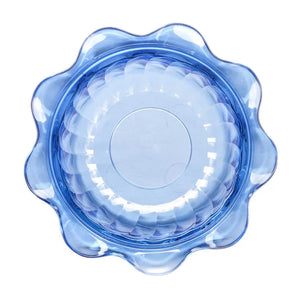 Blue plastic lid with floral design on a white background