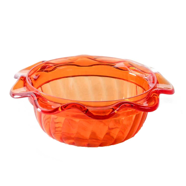 Orange glass pie dish with handles on a white background