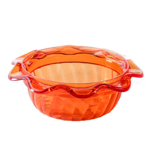 Orange glass pie dish with handles on a white background