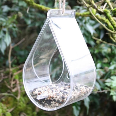 Dewdrop Window Feeder: Clear Perspex bird feeder with suction cups attached to a window, offering close-up views of feeding birds. Includes a hanging rope.