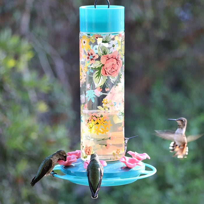 Charming Peony Decorative Glass Hummingbird Feeder with six flower-shaped feeding ports and a built-in perch ring, perfect for attracting hummingbirds to your yard.