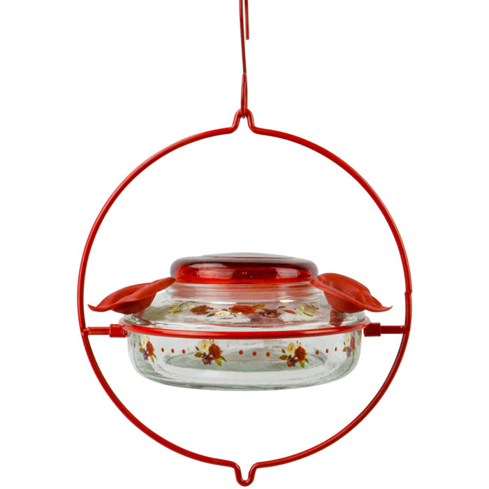 Nature's Way Decorative Top-Fill Glass Hummingbird Feeder, Crimson Corsage, featuring a clear glass dish with a red lid, and three feeding ports.